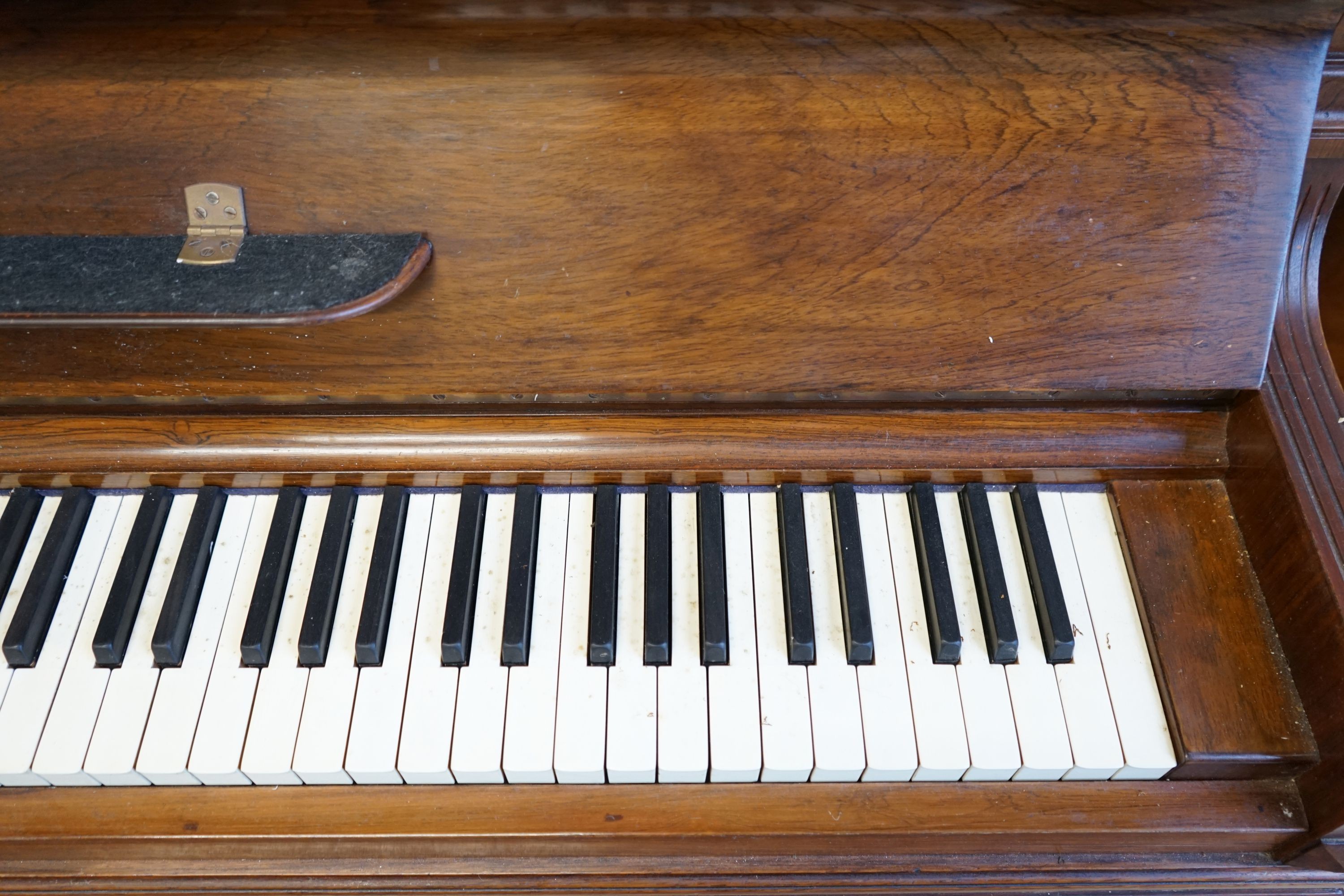 An early 20th century walnut cased Bluthner upright piano, Serial Number 92280